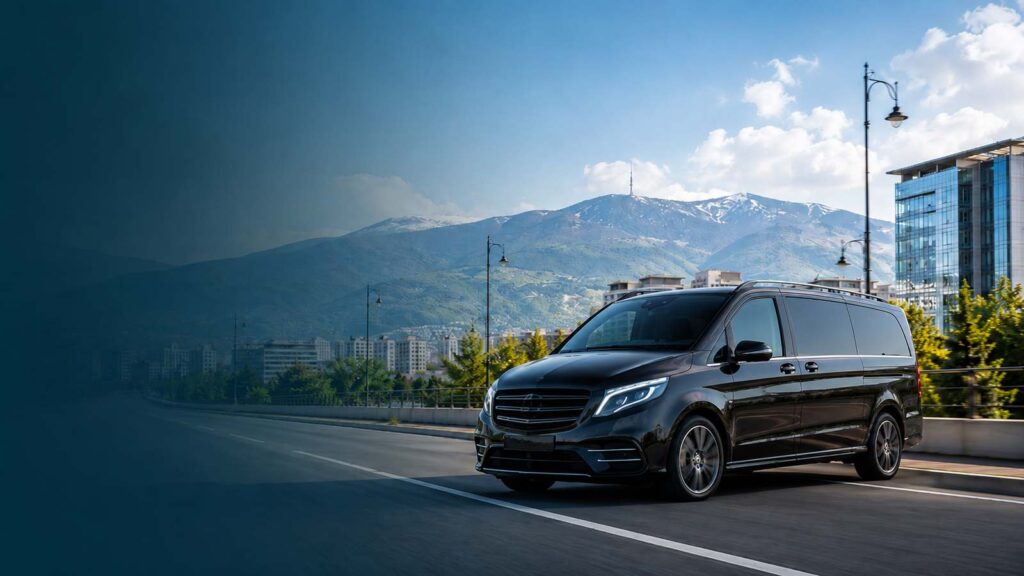 Private Sofia Airport transfers by black minivan with Vitosha Mountain in the background